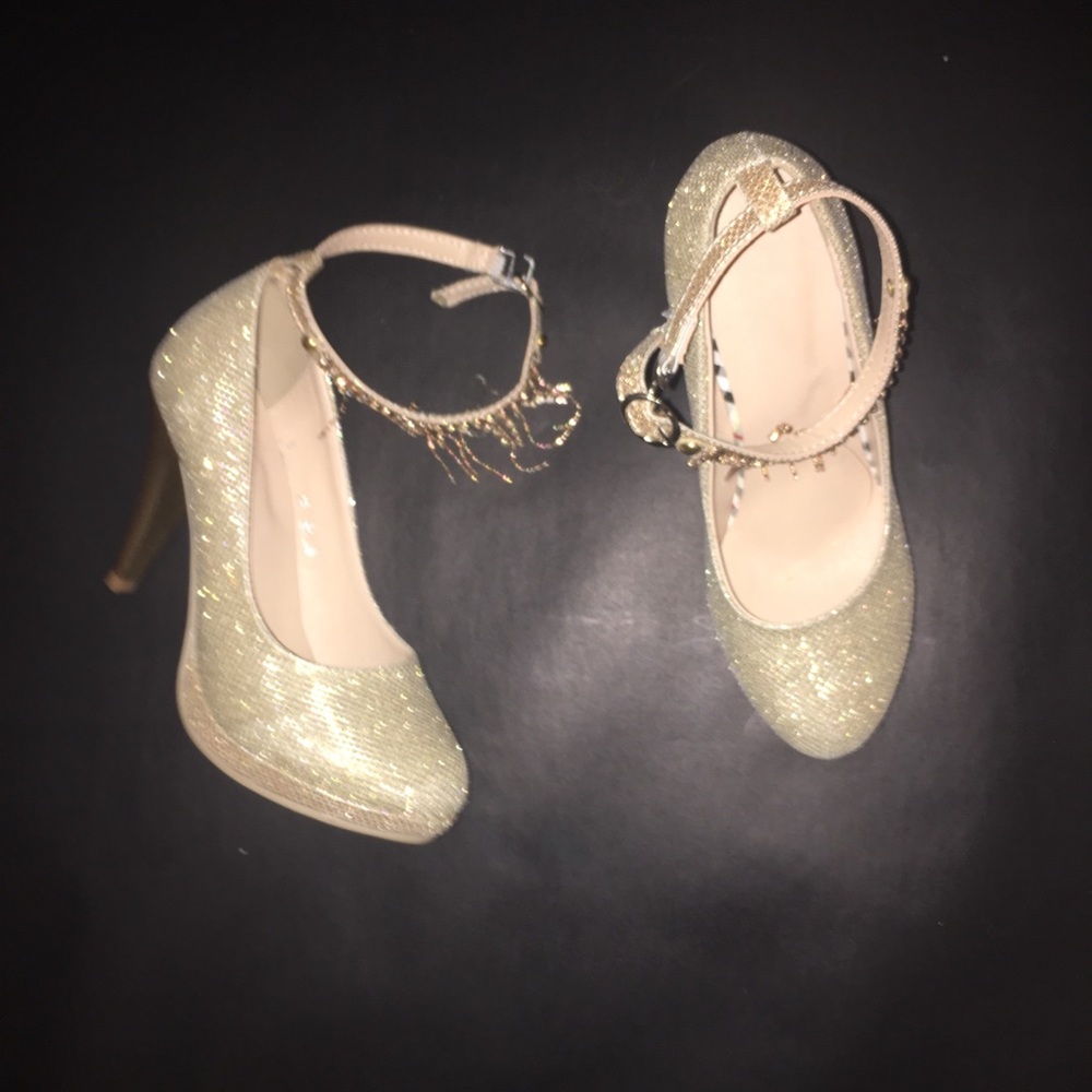 Gold high heeled shoes